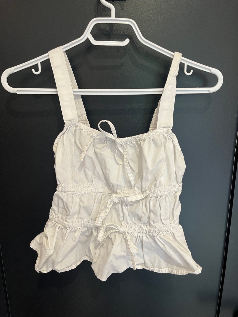 White ruffled top with bows
